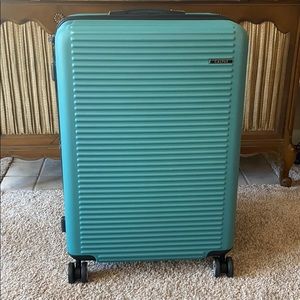 Large Calpak rolling suitcase